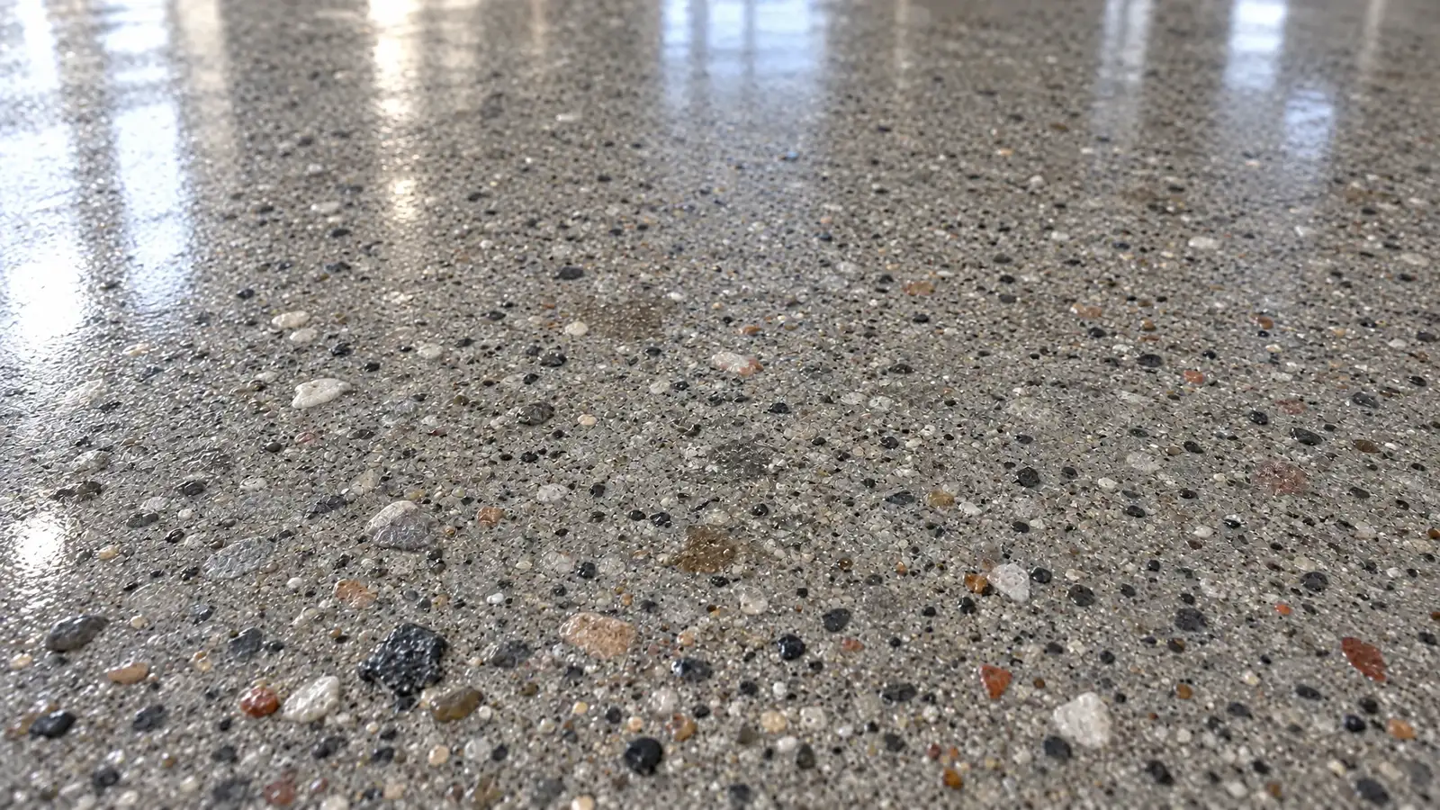 After: A close-up of a concrete surface before and after polishing