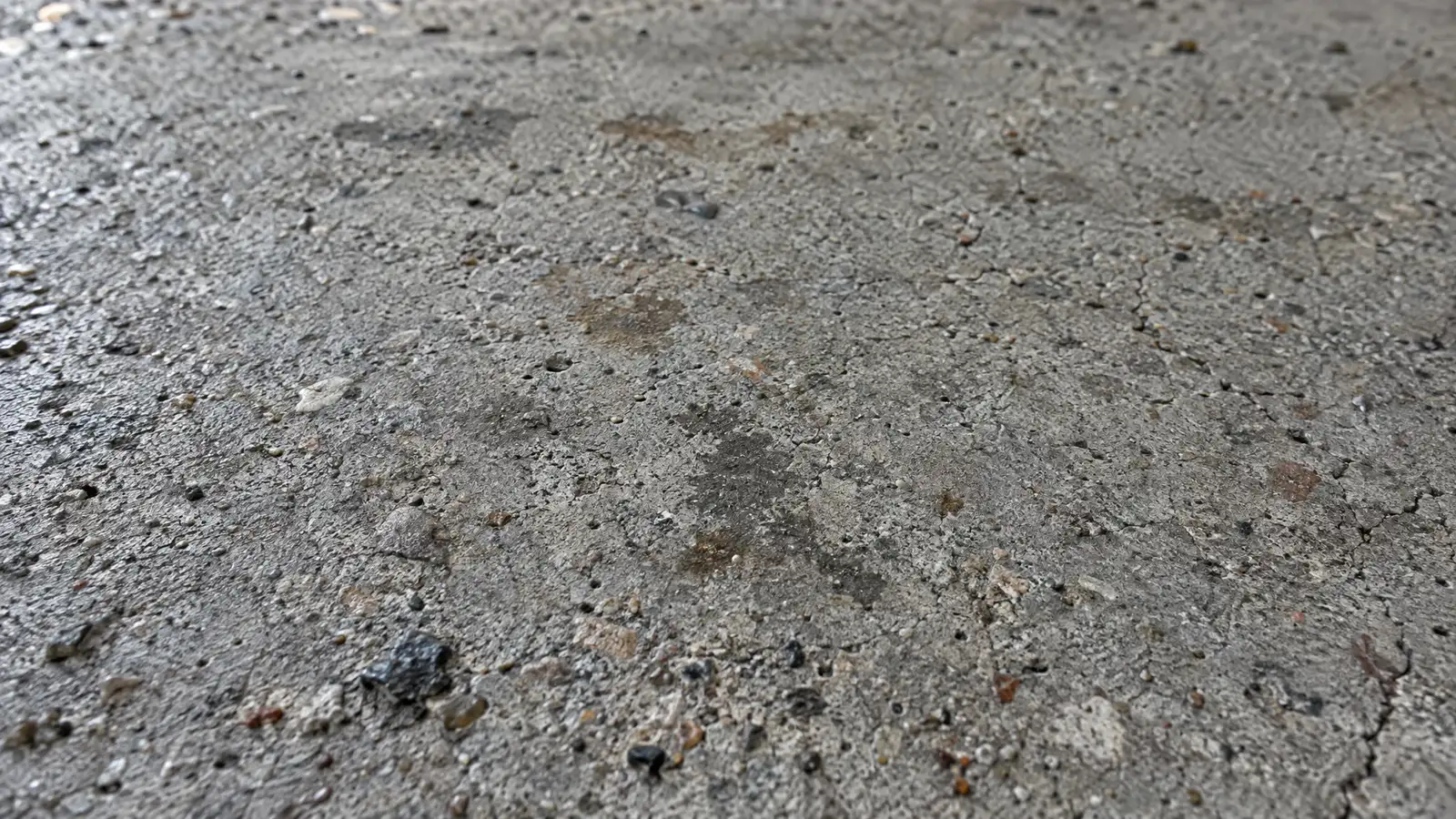 Before: A close-up of a concrete surface before and after polishing