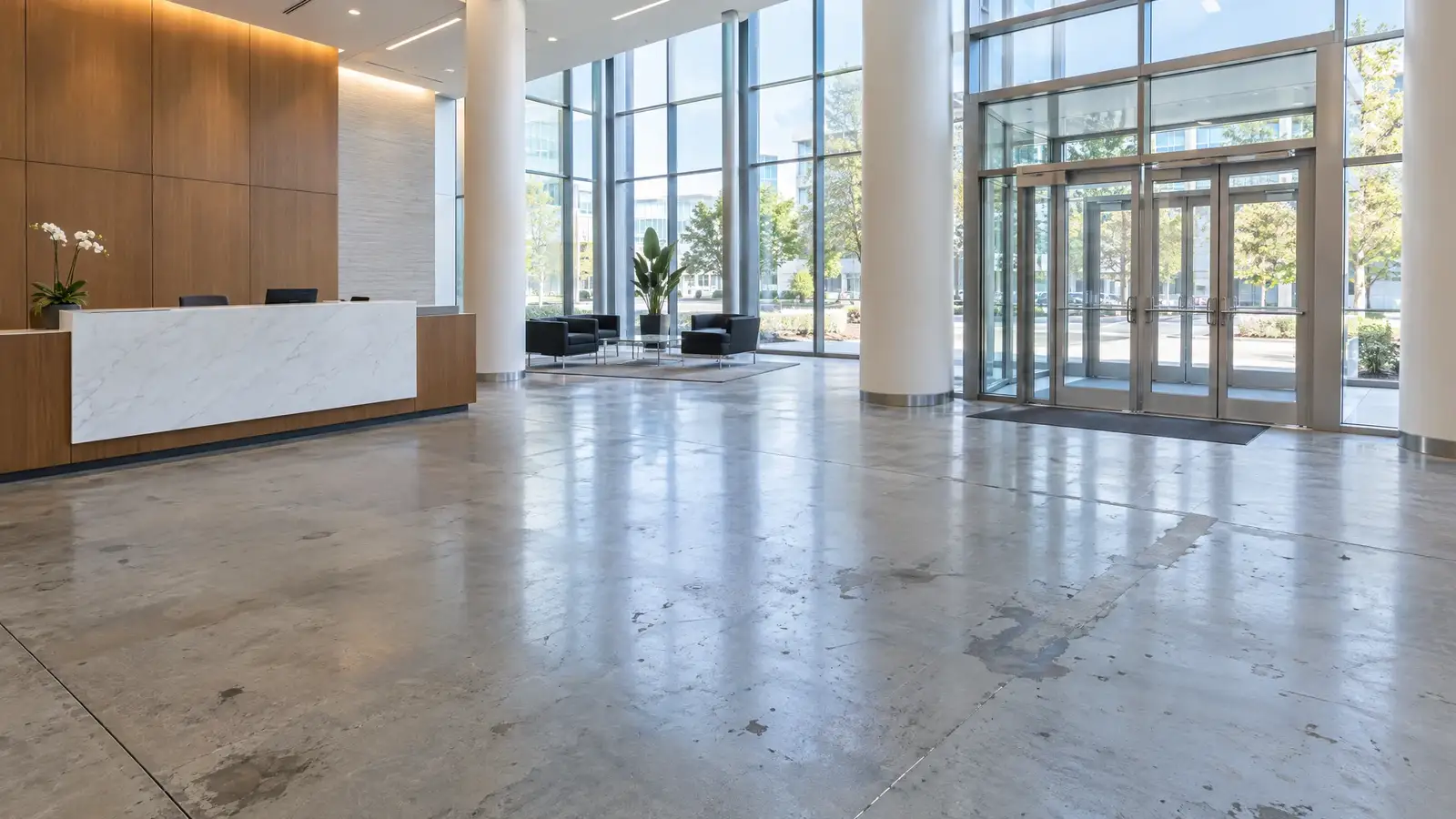 Before: An office lobby floor before and after polishing